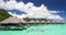 Resort hotel in travel vacation paradise with overwater bungalow in ocean lagoon