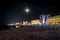 Resort shore under the moonlight and lights of hotels buildings