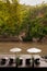 Resort style beach daybeds and umbrellas by river Kwai, Kanchanaburi, Thailand
