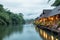 Resort wooden house floating and mountain fog on river kwai