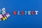 RESPECT word on blue background composed from colorful abc alphabet block wooden letters, copy space for ad text