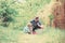 Respecting ecology. small boy child help father in farming. Eco farm. father and son in cowboy hat on ranch. watering