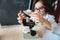 Responsible little girl using science equipment in the laboratory