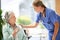 Rest assured...a female carer at a nursing home with her senior patient.