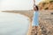 rest beach summer woman walks along the seashore walk