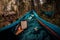 Rest with a book in hammock after long day trekking Taiga forest in Siberia, Russia