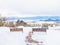 rest chairs on top of mountain for tourist to look view of beautiful nature view with snow and cold of winter