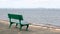 A rest park bench and a view from the shore of a low-water bridge from the Sedanka station to the De Friz peninsula across the Amu