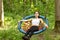 Rest and relaxation. Girl swinging on a swing among the trees