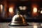 Restaurant bell on a table in a restaurant, shallow depth of field, A closeup of a hotel service bell is placed on the reception