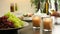 Restaurant buffet with fresh grapes, burning candles and a wine glass posted on the shelf