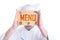 Restaurant chef hiding behind wooden chopping board