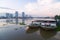 The restaurant cruise ships on Chao Phraya river and city scape in Thailand.
