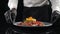 Restaurant food concept. chef presenting his food plate in kitchen. Close up. Restaurant food cooking and serving. Chef