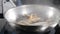 Restaurant food cooking. Slow motion food video. Chef cooking or tosses seafood in frying pan. Splashes of oil. HD