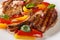 Restaurant food grilled pork chop with warm bell pepper salad close-up in a plate. horizontal
