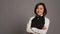 Restaurant hostess posing with confidence in studio