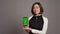 Restaurant hostess presenting smartphone with greenscreen