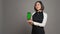 Restaurant hostess presenting smartphone with greenscreen