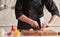 Restaurant hotel private chef cutting mushrooms on board