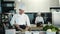 Restaurant Kitchen: Portrait of Male and Female Chefs Preparing Dish. Two Professionals Cooking Delicious, Authentic Food, Healthy