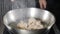 Restaurant kitchen routine , slow motion. close up. Chef hands moving and tossing pan with large shrimps. Deep fried