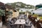 Restaurant open air in philipsburg, sint maarten. Terrace with tables, chairs and yacht in sea. Eating and dining outdoor. Summer