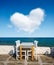 A restaurant overlooking Little Venice, Mykonos Island, Greece. A cloud in the shape of a heart. Lunch and dinner overlooking the
