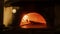 In Restaurant Pizza Peel Transferring Pizza into Wood Fire Stone Oven. Traditional Cooking, Italian