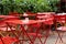 Restaurant red outdoor tables and chairs in summer