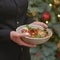 Restaurant services. Waitress with food dish serving vegetable salad in restaurant.