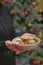 Restaurant services. Waitress with food dish serving vegetable salad in restaurant.