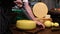 Restaurant serving - man cutting a cheese head in half with a knife
