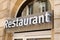 Restaurant sign neon on a city street storefront