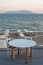 Restaurant table and chairs with a relaxing view of Samothraki i