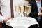 Restaurant waiter brings people and alcohol champagne