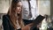 Restaurant waiter giving menu to businesswoman. Beautiful woman reading menu