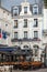 Restaurants with people dining outdoors on Place Chateaubriand in Saint Malo, Brittany,