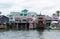 The restaurants and ship on the dock by John`s Pass and the canal near Madeira Beach, Florida, U.S