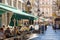 Restaurants with tables and umbrellas outside Krajla Petra street in the old town, Belgrade, Serbia.