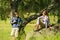 Resting couple hikers laughing at each other