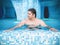 Resting man lies and relaxes in the pool.Guy is relaxing in the jacuzzi Back view. Adult man lying in the pool and