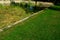 restoration of a pond with a stone wall buried under the terrain.