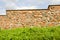 Restored ancient wall made of brick and stones.