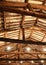 Restored roof with wooden beams and the lamps