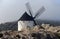 Restored spanish windmill behind the rocks