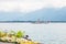 Restored traditional paddle steamboat Montreux cruising on Lake Geneva Lac Leman with summer flowers along Montreux promenade,