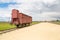 Restored transport wagon with the entrance of former Nazi concentration camp Birkenau