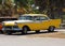 Restored Yellow Taxi At Playa Del Este Cuba