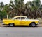 Restored Yellow Taxi At Playa Del Este Cuba